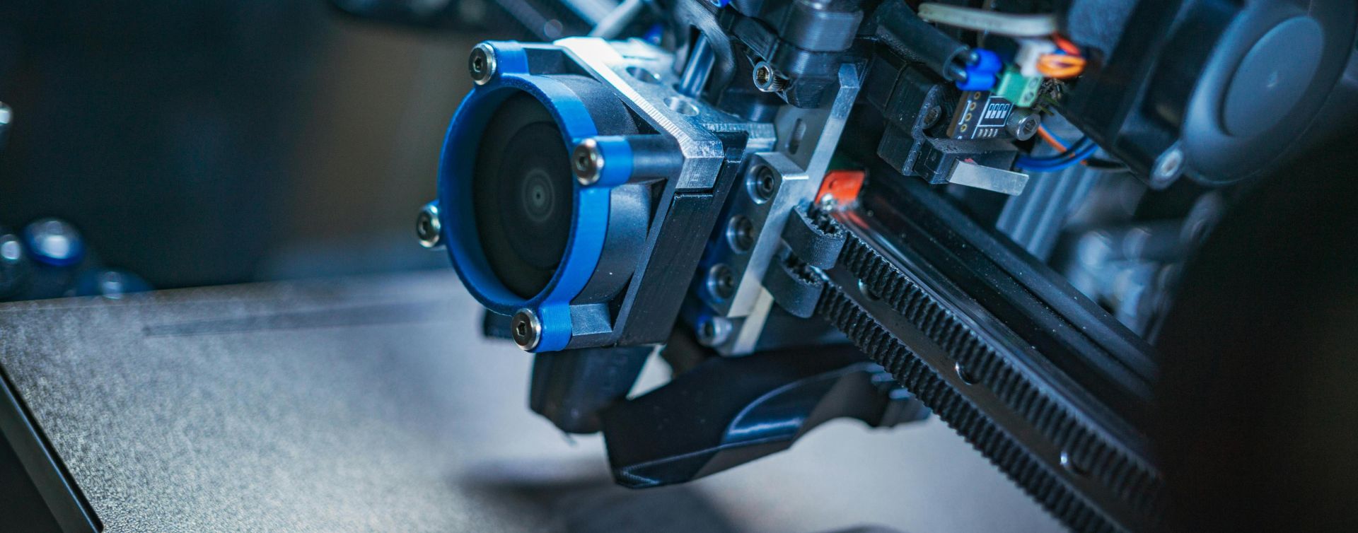 Detailed view of a high-tech 3D printer mechanism showcasing precision engineering.